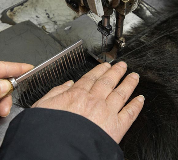 Sewing hair with machines